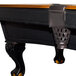 A close-up of a tan Minnesota Fats pool table with black and gold details.