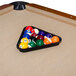 A Minnesota Fats pool table with a triangle of billiard balls.