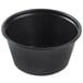 A black plastic Solo portion cup with a white background.