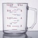 A clear Cambro measuring cup with measurements in red and blue.