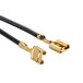 A close-up of two gold and black cables with a black connector.