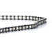 A black and silver drive chain for a Nemco hot dog grill.