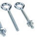 A group of three stainless steel Nemco eyebolts with nuts.