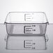 A clear square Rubbermaid food storage container with measurements on it.