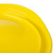 A yellow Rubbermaid food storage container lid.