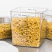 A group of Rubbermaid clear square food storage containers with pasta inside.