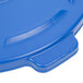 A blue Rubbermaid BRUTE lid with a handle on top.