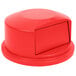 A red round Rubbermaid lid for a 44 gallon container.