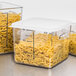 A Rubbermaid clear square food storage container filled with pasta.