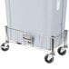 A grey plastic container on a stainless steel cart.