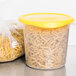 A Rubbermaid translucent plastic container with pasta inside.