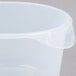A Rubbermaid translucent round plastic food storage container with a lid.
