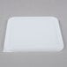A white square Rubbermaid lid on a white plastic container.