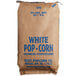 A brown and white bag of Reist white large butterfly popcorn kernels.