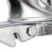 A close-up of the Robot Coupe Bulk Feed Head's metal clamp.
