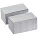 A stack of silver and gray paper napkins.