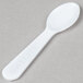 A white Solo plastic taster spoon.