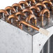 An Avantco condenser coil with copper pipes.