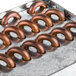 A metal tray with copper condenser coils.