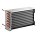 An Avantco condenser coil with copper tubing and copper pipes inside a metal box.