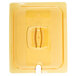A yellow plastic lid for a Rubbermaid food pan with a handle.