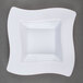 A white square plastic bowl with a wavy edge.