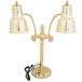A Hanson Heat Lamps brass freestanding heat lamp with dual bulbs on a round solid style base.