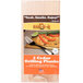 A package of two Chef Master cedar wood grilling planks on a counter with a piece of salmon.