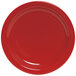 A close-up of a Tuxton Cayenne Colorado china plate with a red background and white line.