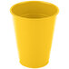 A School Bus Yellow plastic cup on a white background.