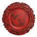 A red Charge It by Jay plastic charger plate with black and red designs.