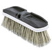 A Carlisle vehicle and wall cleaning brush with a white handle and black bristles.