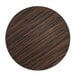 A circular wood surface with brown and black stripes.