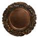 A Charge It by Jay dark oak plastic charger plate with a carved scroll design.