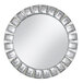 A round mirror with a silver rim and diamond pattern.