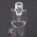 A close-up of a Cleveland halogen lamp glass tube with a small metal object inside.