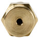 A brass threaded nut with a hexagon-shaped hole.