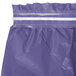 A purple plastic table skirt with a white strip.