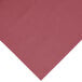 A close-up of a burgundy plastic tablecloth.