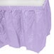 A Luscious Lavender plastic table skirt with ruffles.