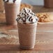 A chocolate milkshake made with Big Train Reduced Sugar Mocha Blended Ice Coffee Mix and topped with whipped cream and chocolate chips.