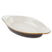 A white oval dish with a brown rim.