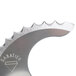 A close-up of a Robot Coupe Coarse Serrated "S" Blade.