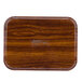 A rectangular wooden Cambro tray with a rectangular shape on a wood surface.