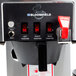 A Bloomfield automatic coffee brewer with three warmers.