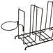 A black metal rack with five metal holders for cups and lids.