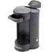 A black Conair Cuisinart 1-cup coffee maker with a lid on top.
