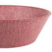 A red polyethylene round basket with raspberries in it.