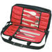 A red Mercer Culinary knife case with knives inside.
