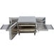 A large stainless steel TurboChef countertop conveyor oven with open doors.